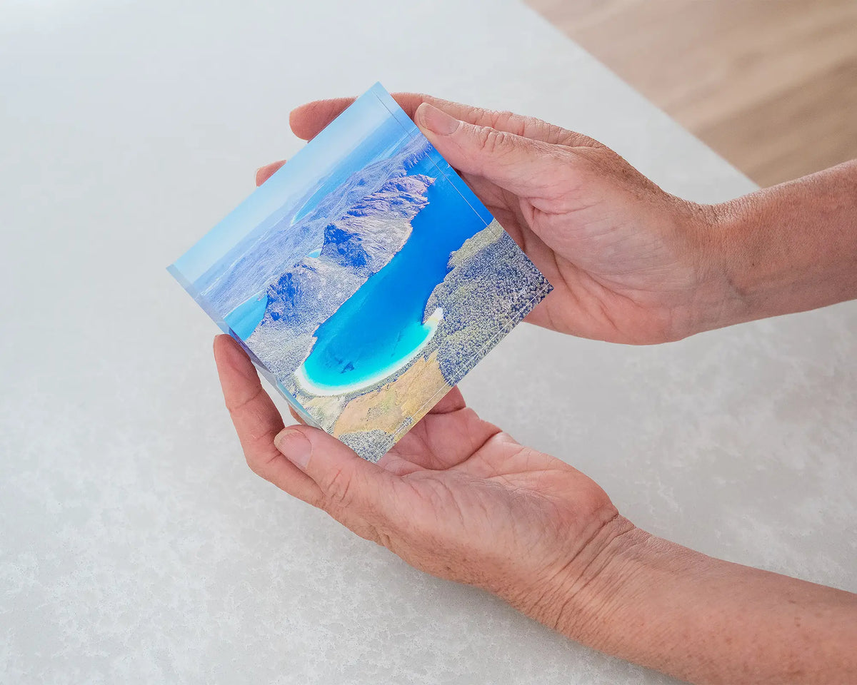 Blue Beauty. 10cm acrylic block aerial view of Wineglass Bay Tasmania, held in hands.
