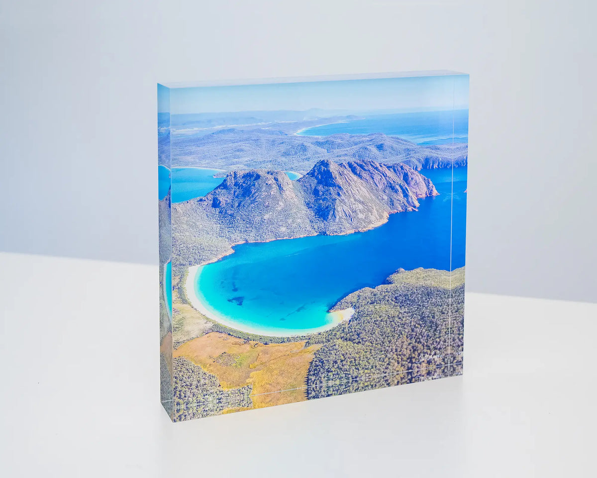 Blue Beauty. Acrylic block aerial view of Wineglass Bay Tasmania, sitting on a desk.