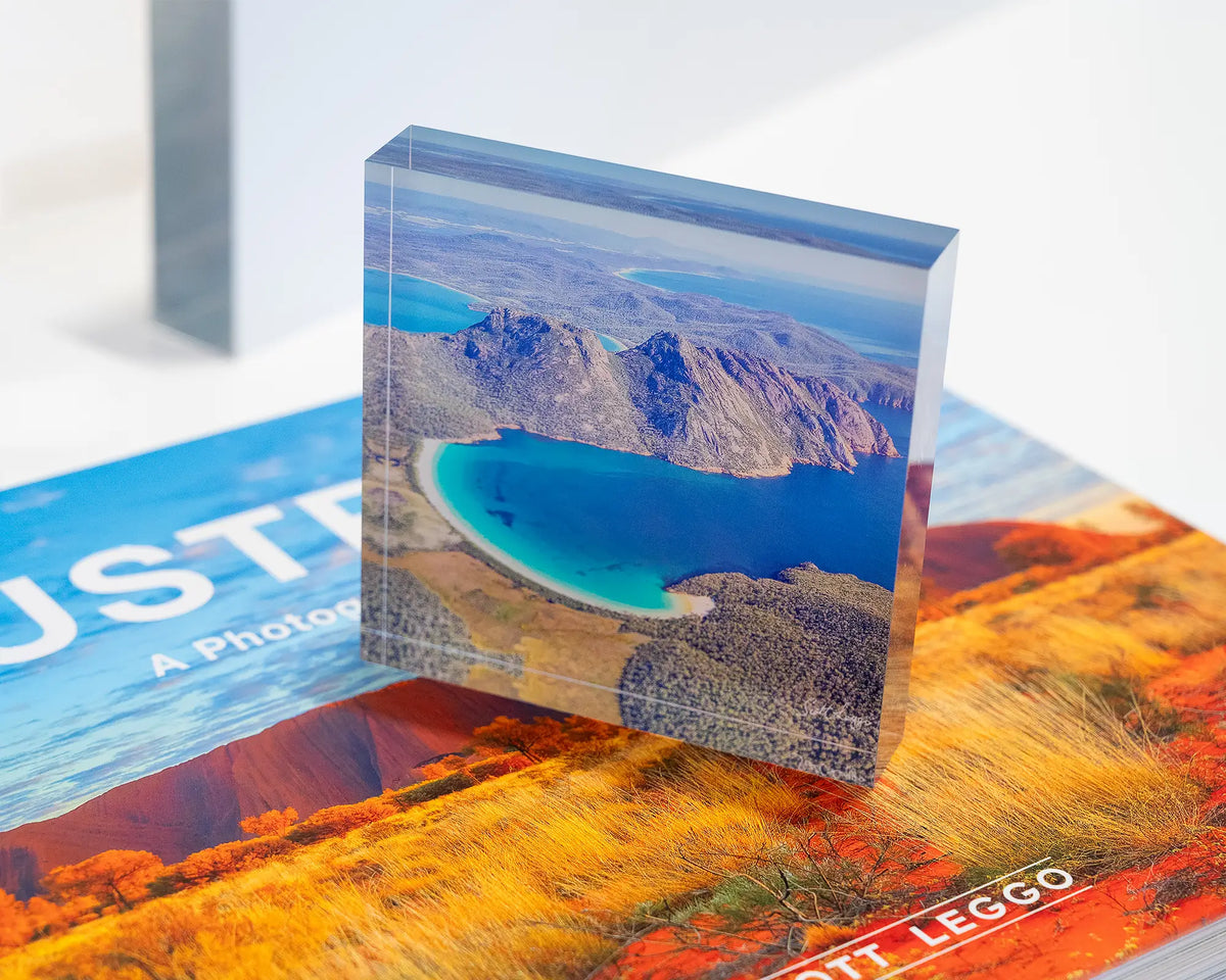 Blue Beauty. Acrylic block aerial view of Wineglass Bay, Tasmania, placed on SCOTT LEGGO Australia book.