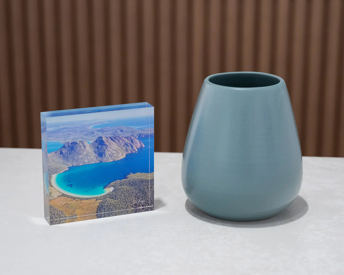 Blue Beauty. Acrylic block aerial view of Wineglass Bay, Tasmania, styled with a small vase.