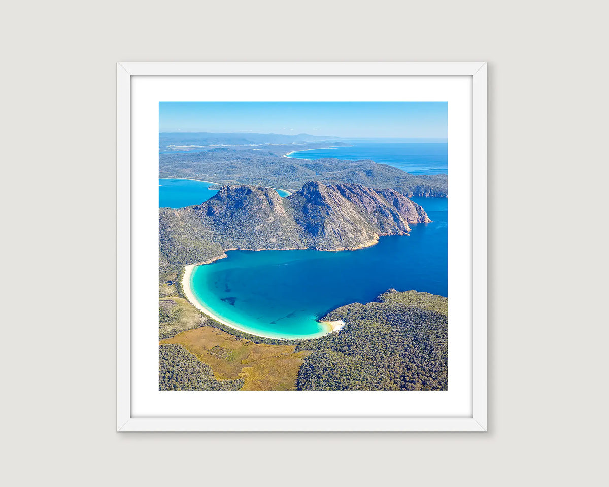 Framed photograph of Wineglass Bay, Freycinet National Park, from an aerial view. 