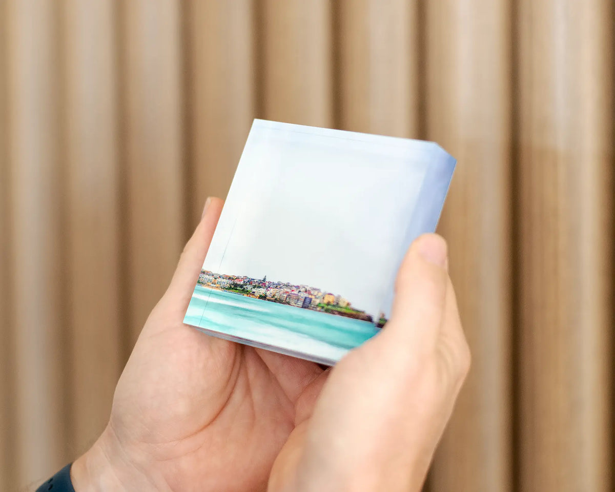 Bondi Views - 10cm acrylic block of Bondi being held in hand.