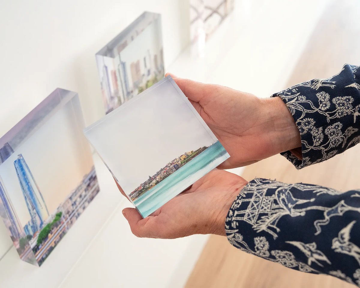 Bondi Views. Acrylic block of coastal views of Sydney being held in hands.