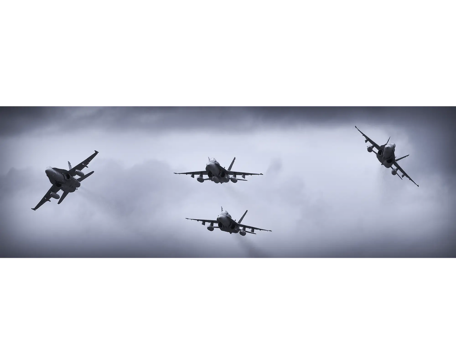 RAAF F/A-18 Hornets breaking formation.