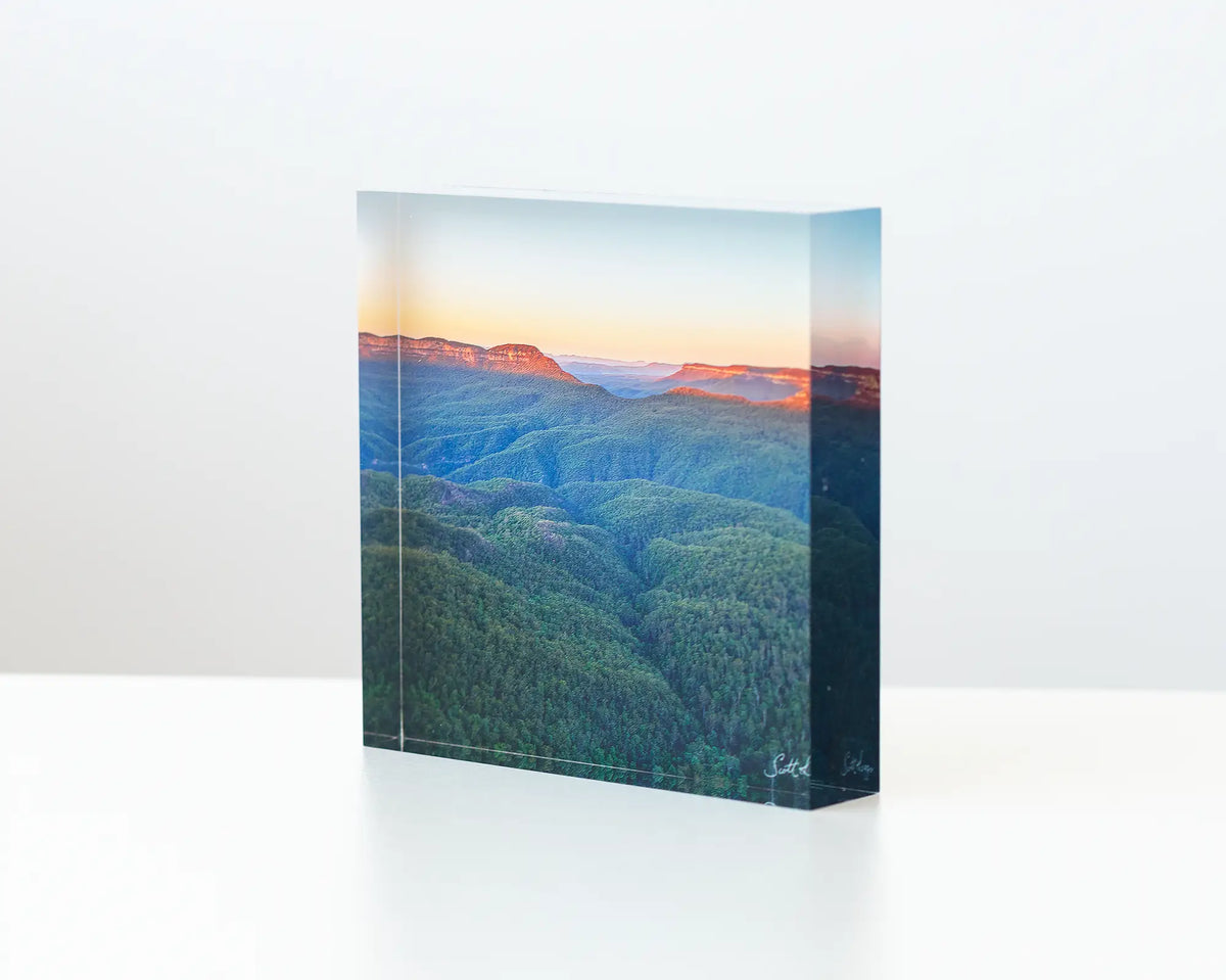 Breaking Dawn - Acrylic block - Blue Mountains artwork sitting on desk.