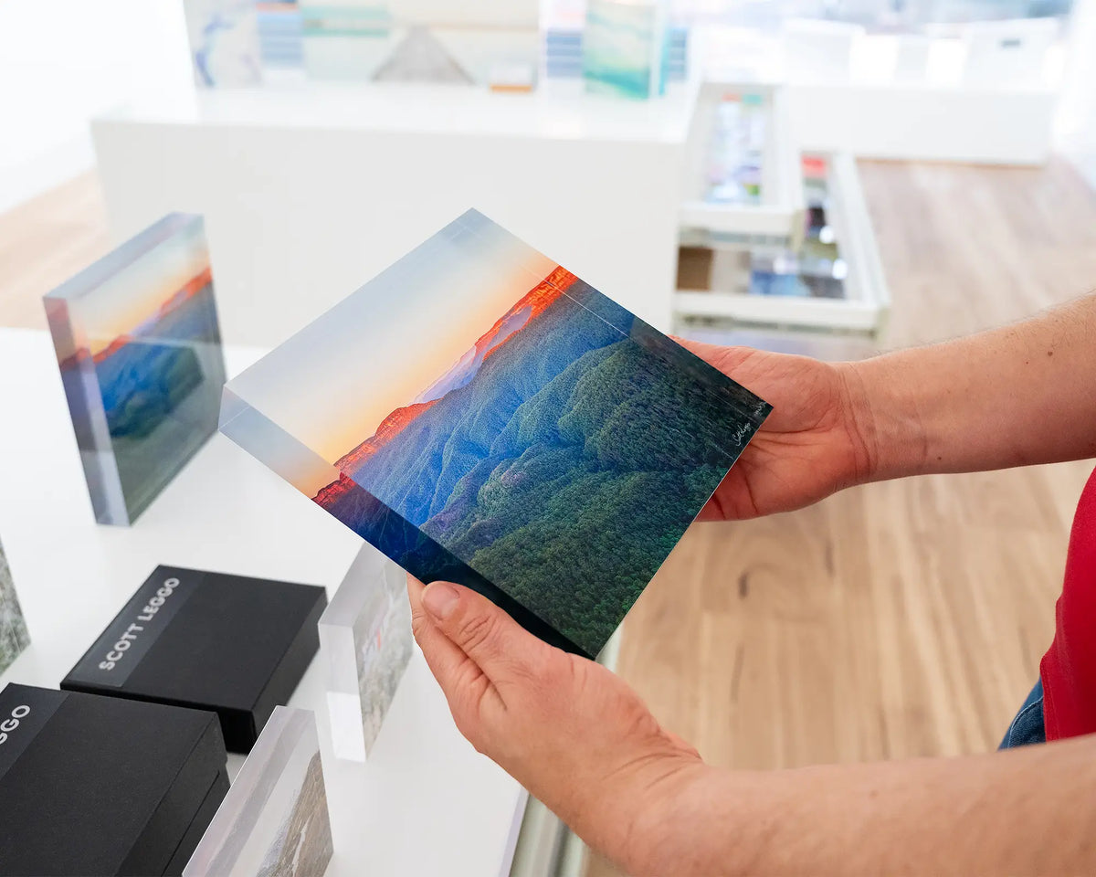 Breaking Dawn. Acrylic block of sun rising over Blue Mountains National Park, hand held in gallery.