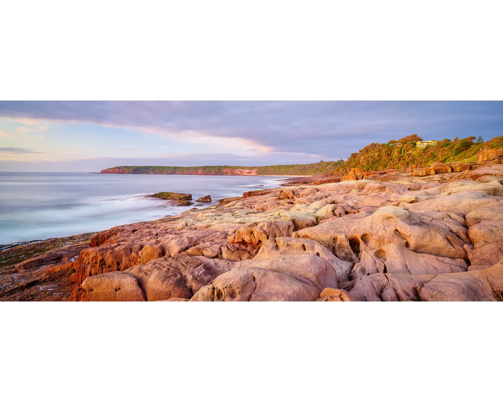 Breaking Through. Sunrise at Short Point, Merimbula, New South Wales.