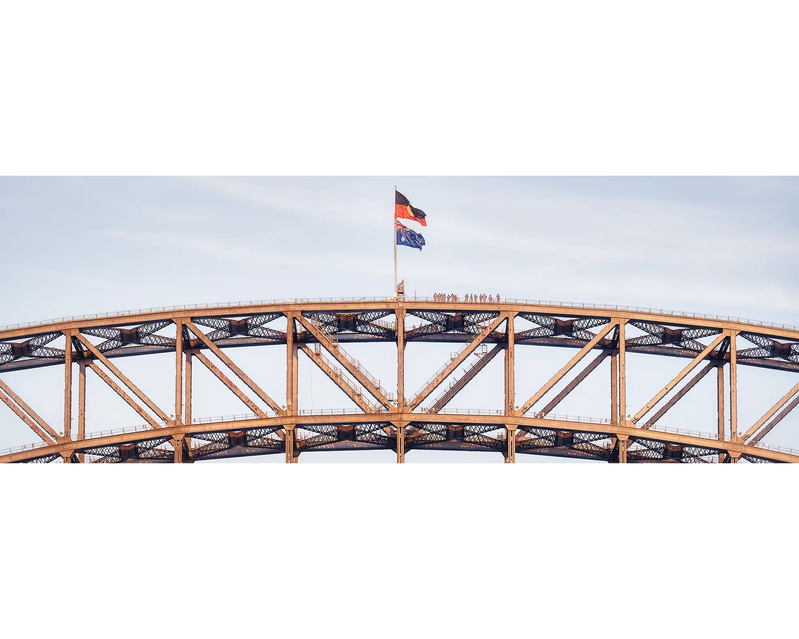 Bridge Climb. People on top of Sydney Harbour Bridge at sunset.