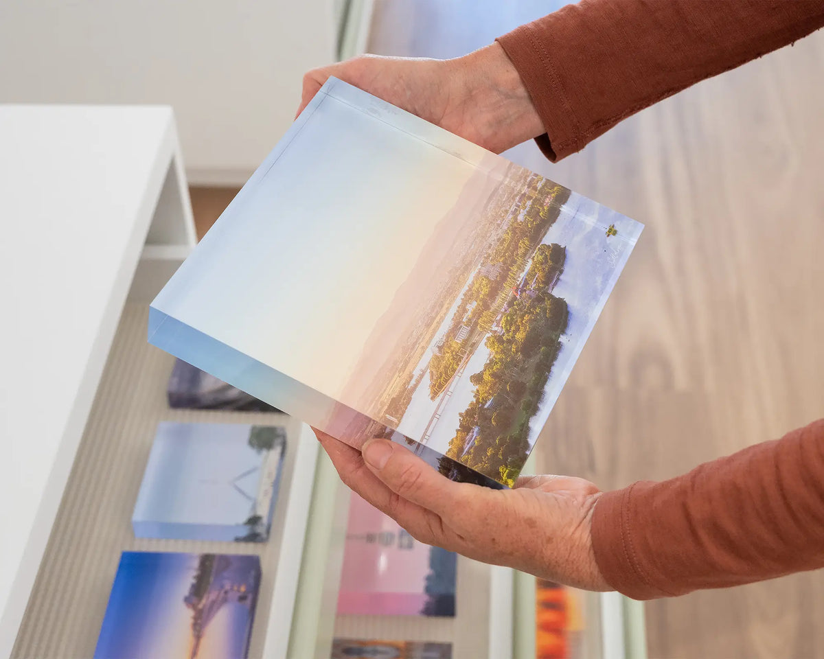 Brighter Days. Acrylic block of Autumn sunrise over Lake Burley Griffin Canberra, hand held in gallery.