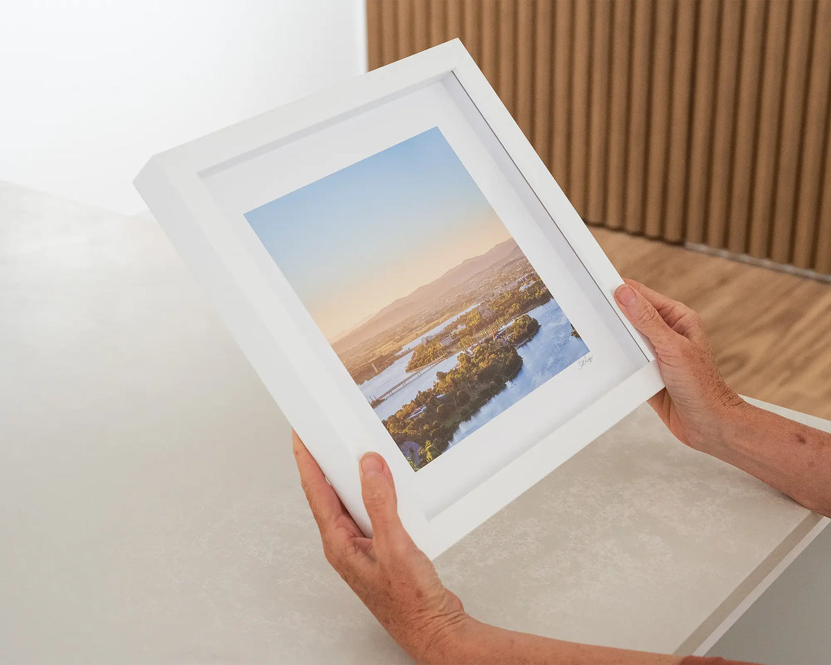 Brighter Days. Bright autumn morning over Lake Burley Griffin Canberra, with white frame, being hand held.