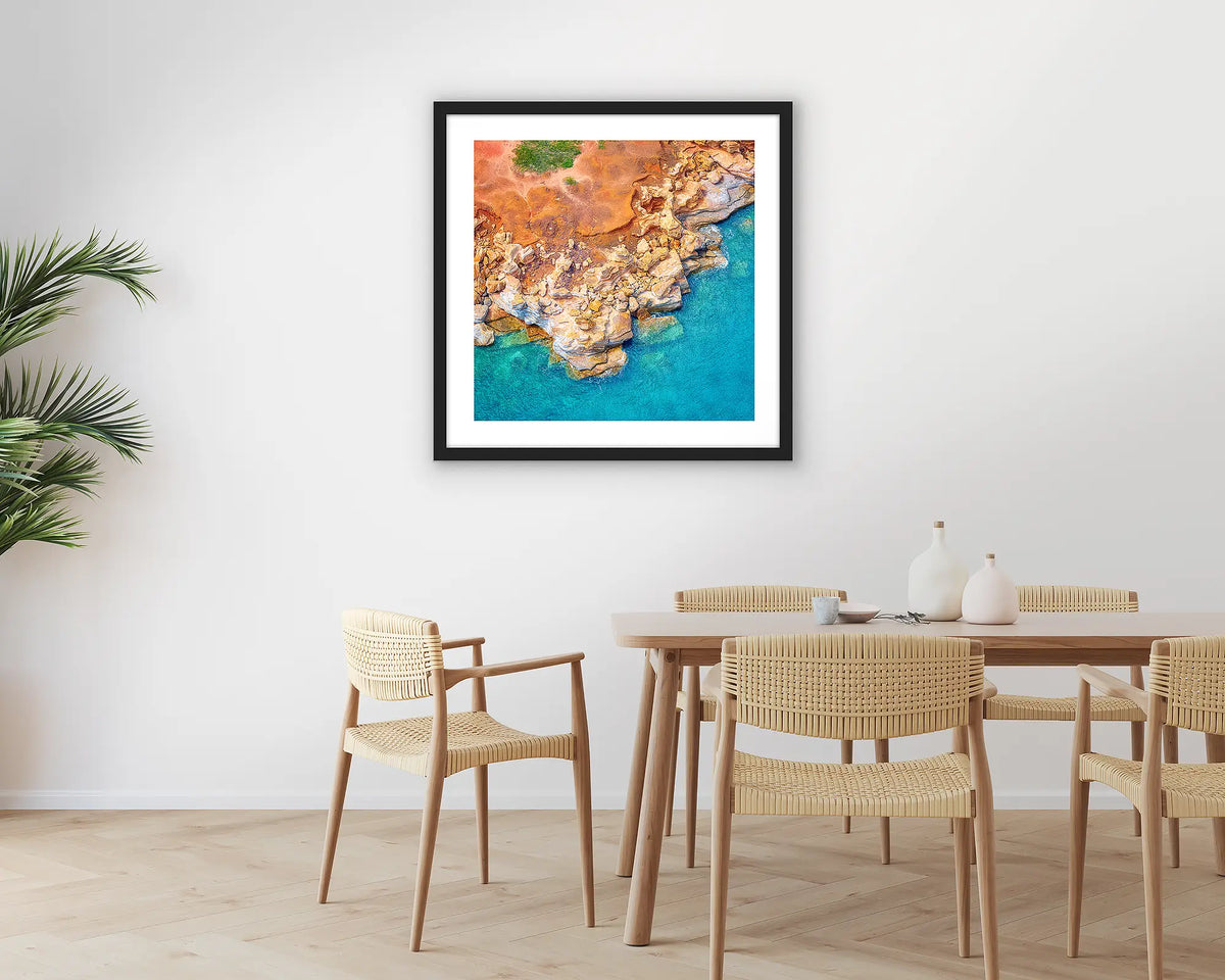 Broome Contrasts. Photographic wall art print of Gantheaume Point, Broome, with a black frame hung in a dining room. 