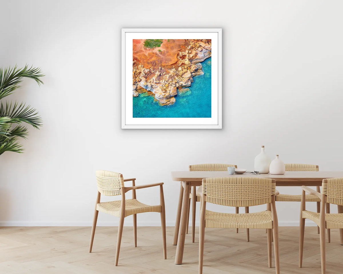 Broome Contrasts. Photographic wall art print of Gantheaume Point, Broome, with a white frame hung in a dining room. 