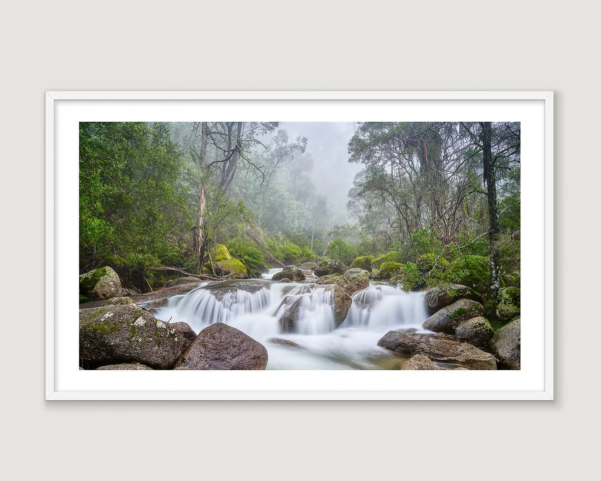 Framed wall art of mist and water cascading over rocks in Mount Buffalo National Park. 