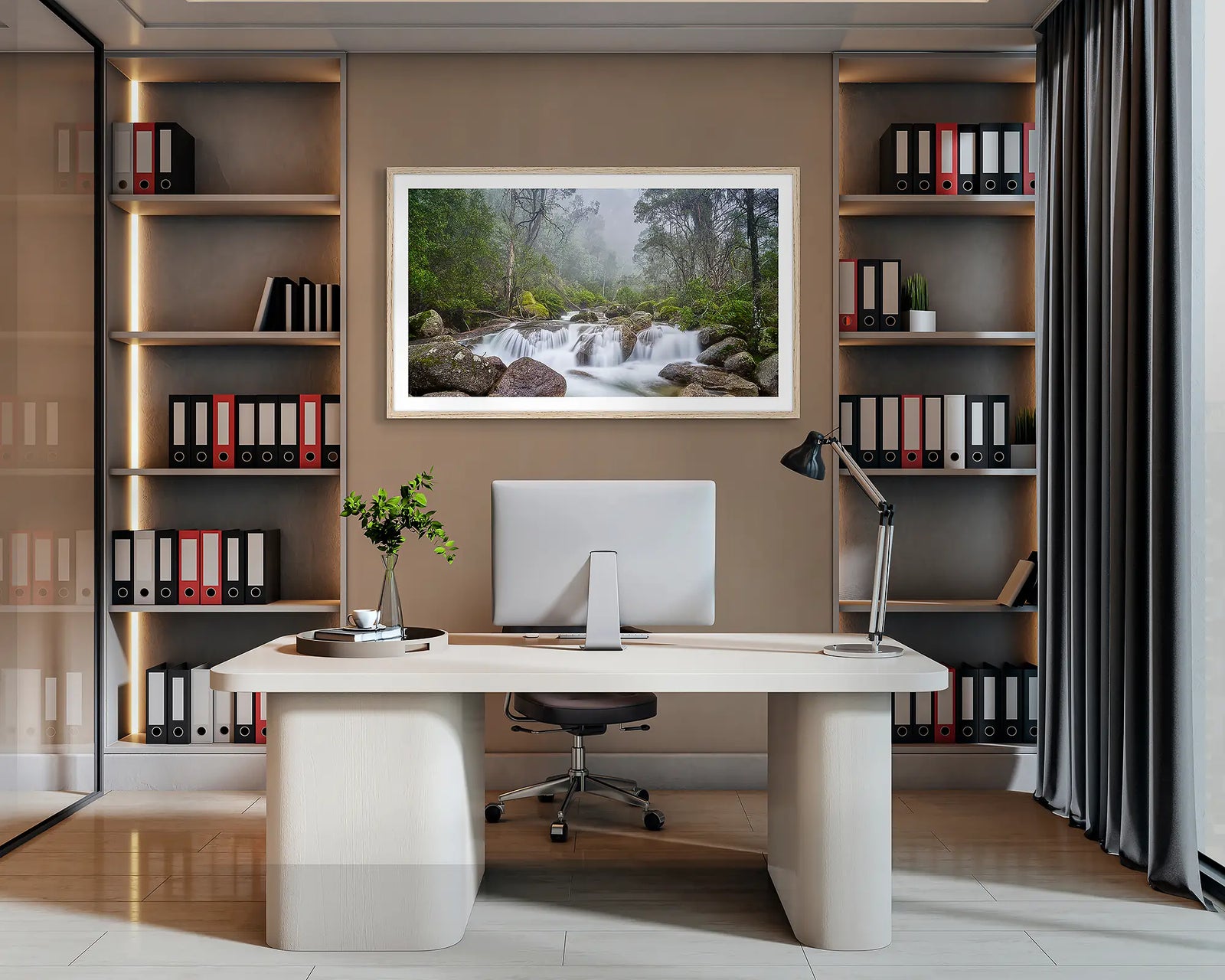 Buffalo Cascade. Wall art print of Eurobin Creek, Mount Buffalo, with a Tasmanian Oak frame, hanging behind a desk in a corporate office. 
