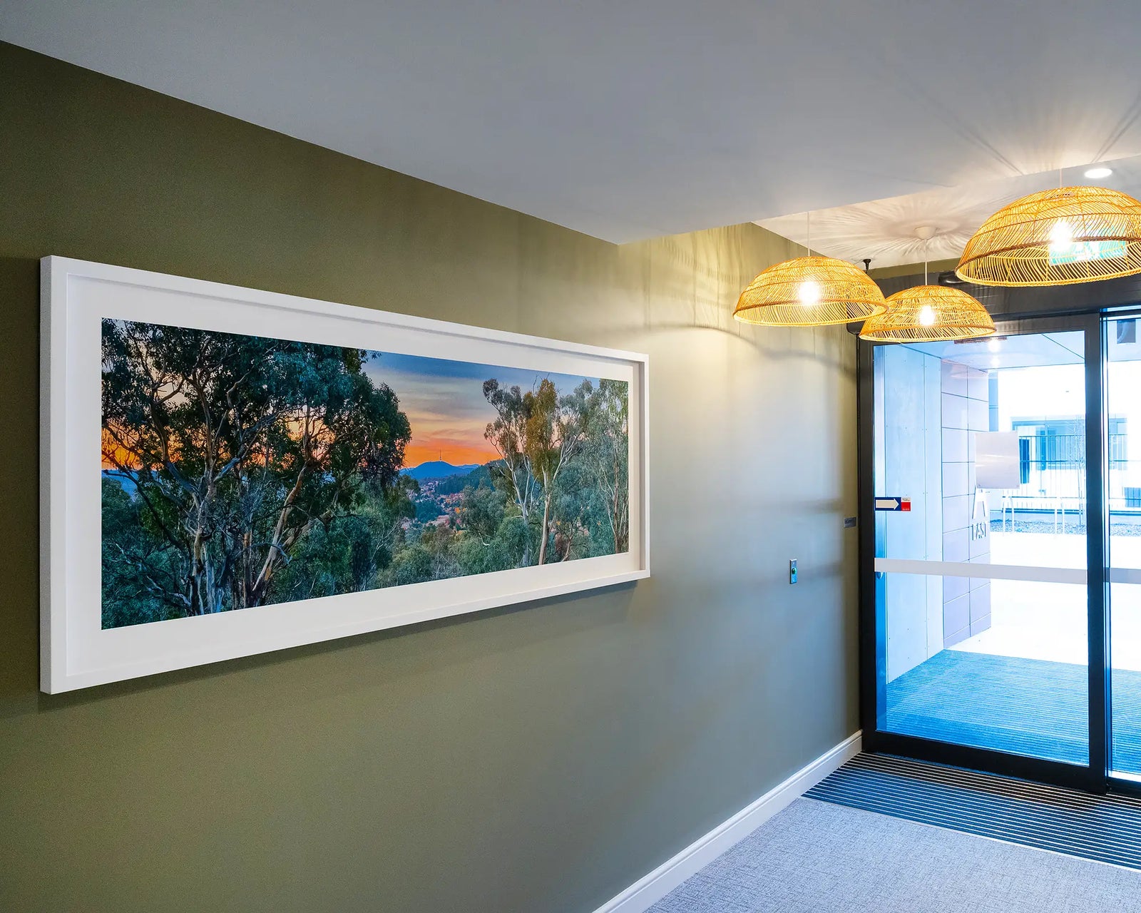 Framed artwork of Canberra Bushland with a view to a sunset over Black Mountain. 