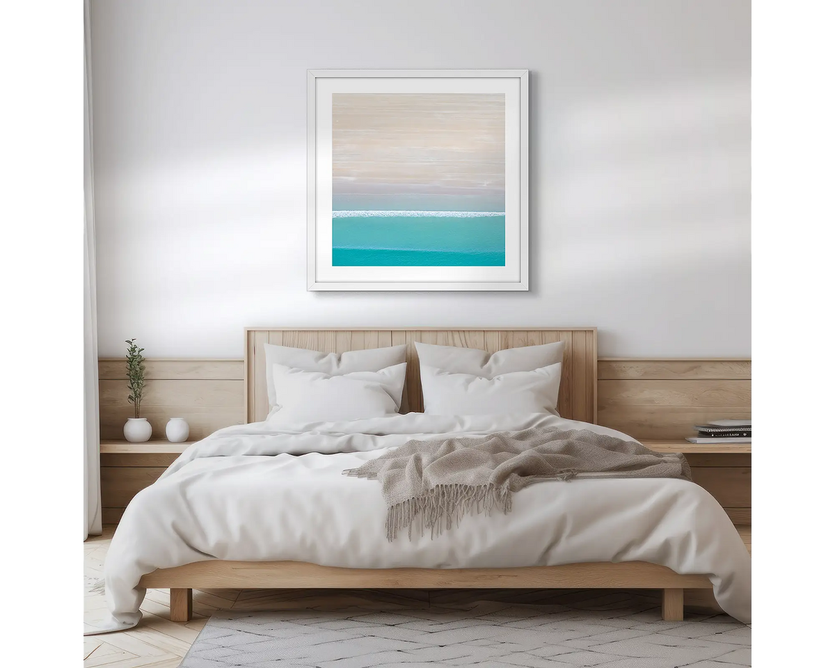 Cable Calm. Broome coastal photographic wall art print, with a white frame, hung in a scandi bedroom.