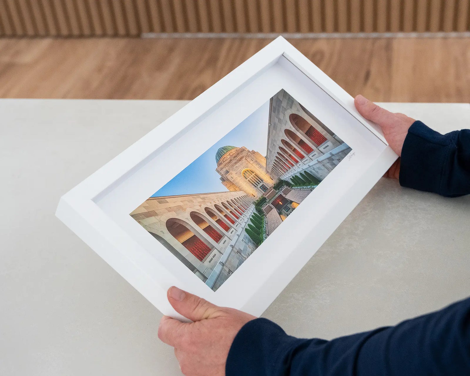 Stunning architectural scene of Australian War Memorial, framed in white.