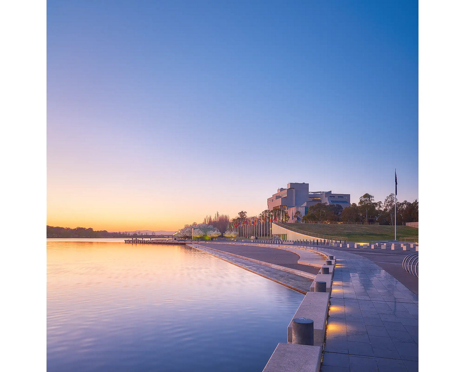 Canberra Awakes. Sunrise over Lake Burley Griffin and the HIgh Court, Canberra.