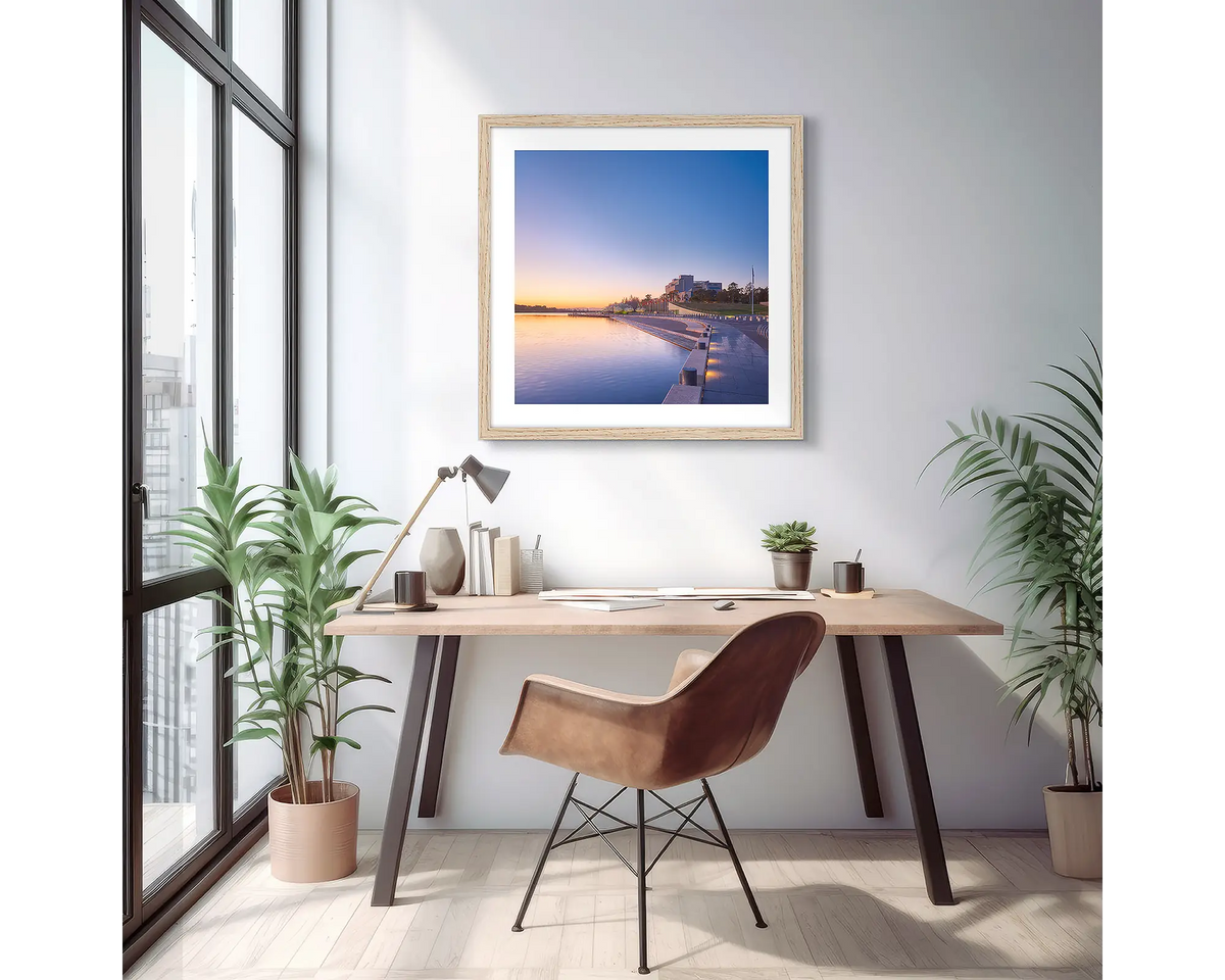 Canberra Awakes. Wall art print of a Canberra sunrise over the high court, with a timber frame in a light filled apartment. 