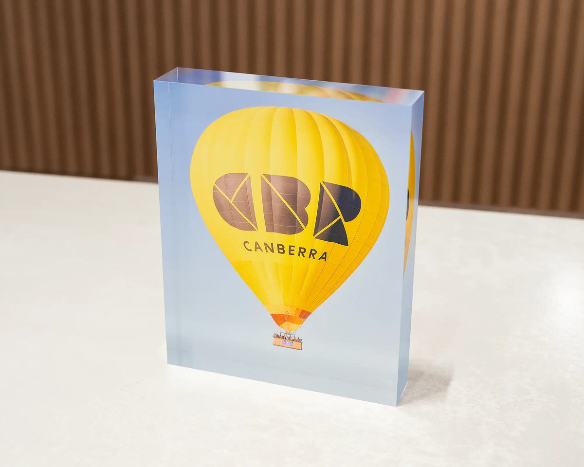 Canberra Bubble. Acrylic block of hot air balloon sitting on desk.