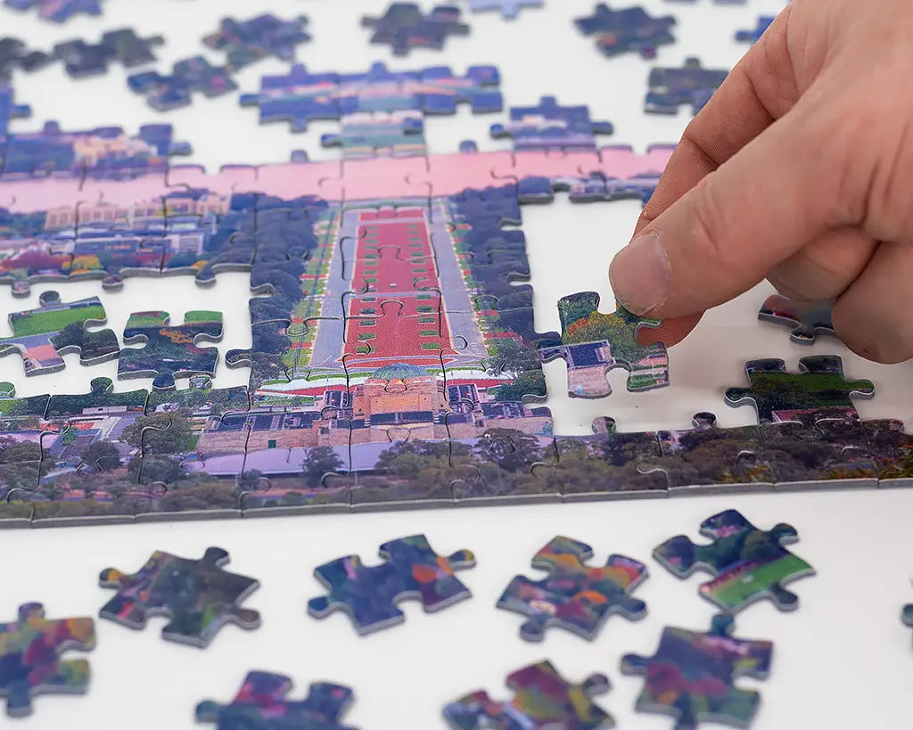 canberra jigsaw puzzle being completed by hand