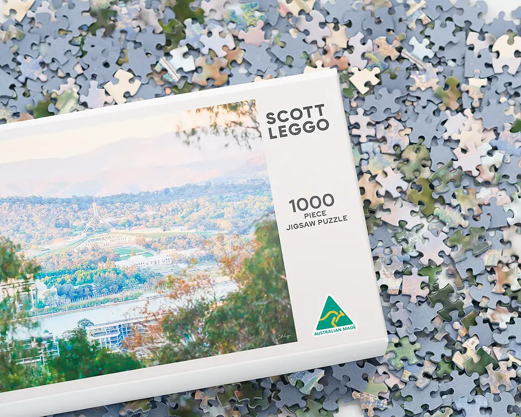 Canberra jigsaw puzzle box with jigsaw puzzle pieces