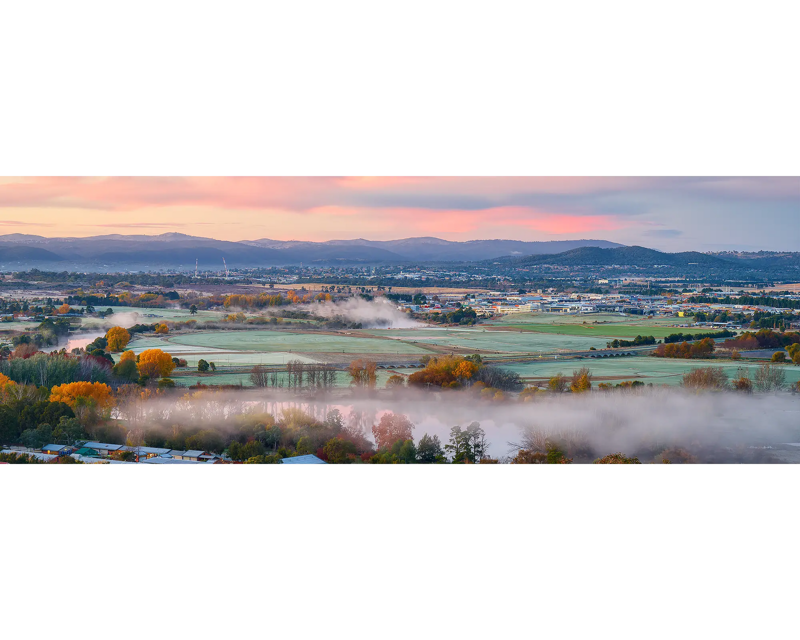 Canturf. Autumn sunrise over Fryshwick and Queanbeyan.