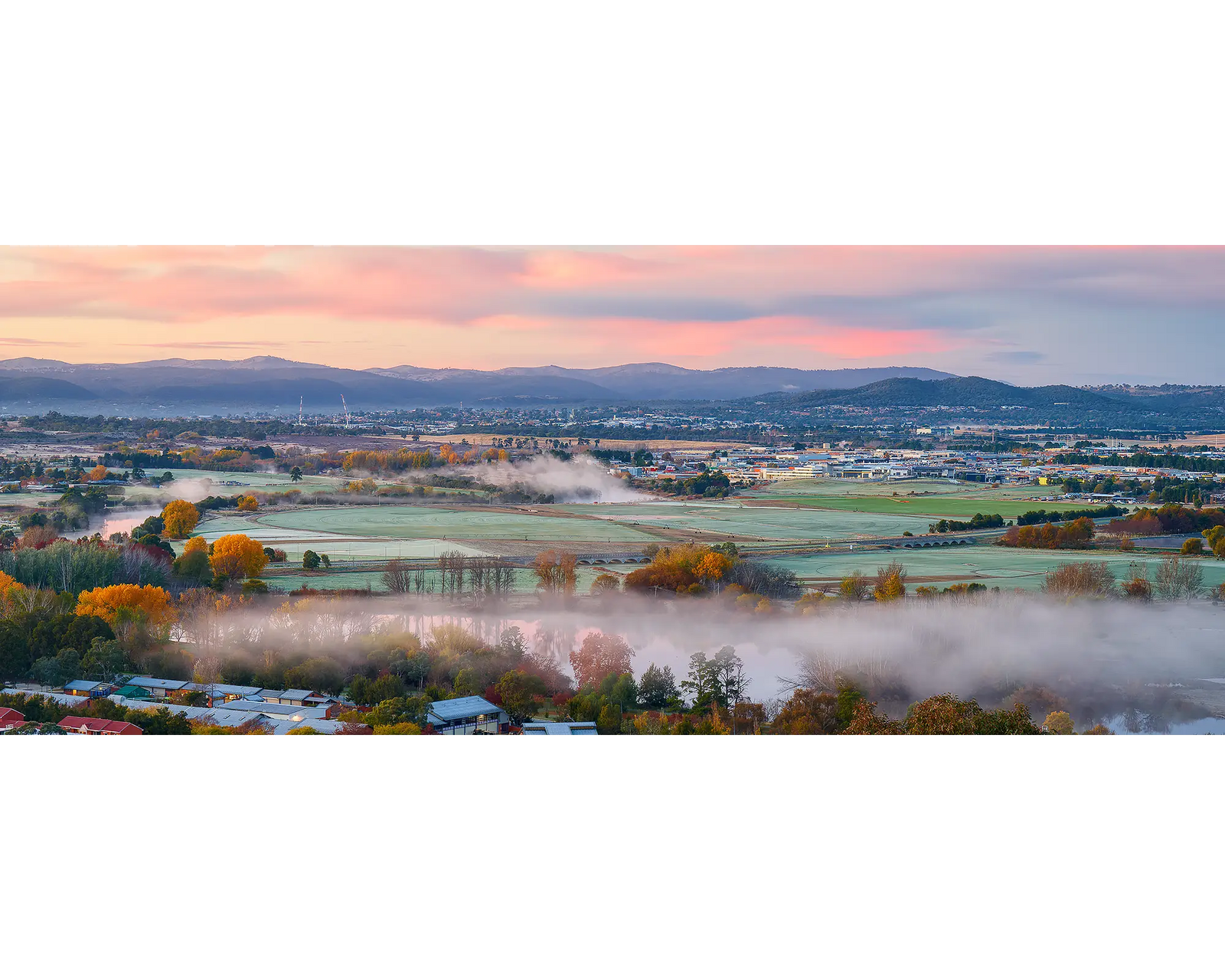 Canturf. Sunrise over Fyshwick and Queanbeyan.