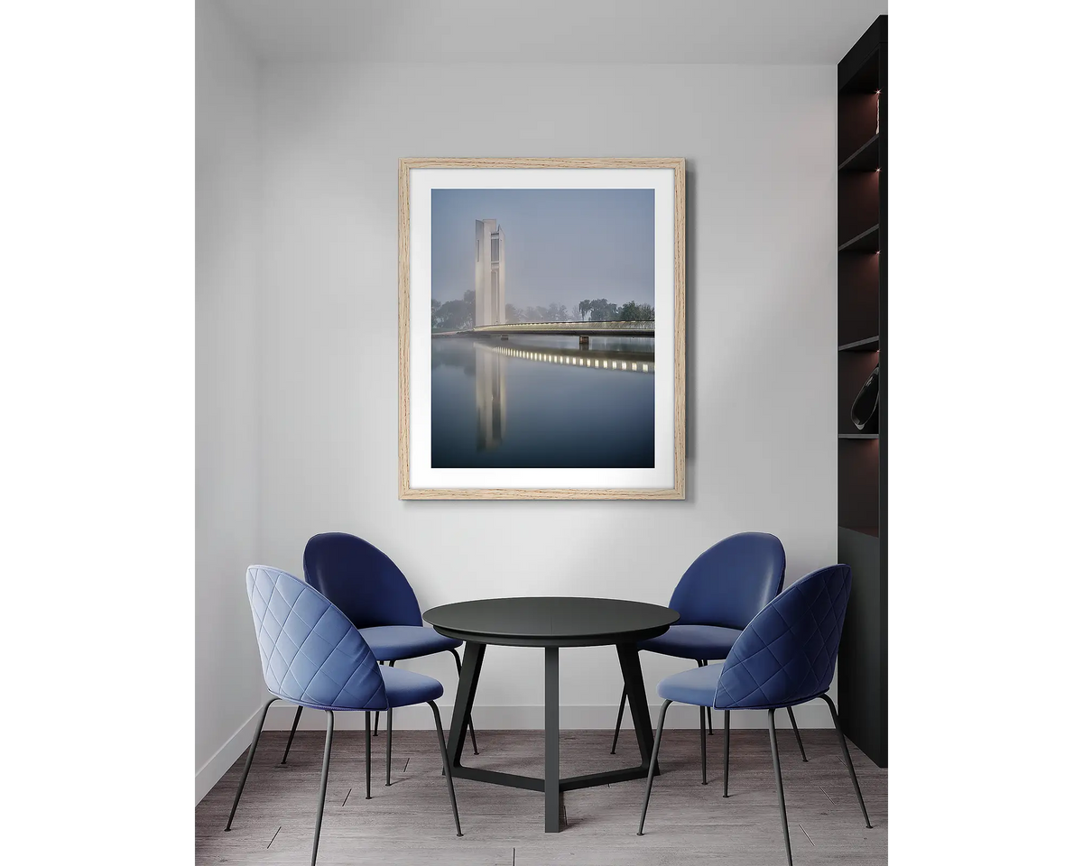 Carillon Blues. Canberra, framed wall art print, with a Tasmanian Oak frame, in an office meeting room. 