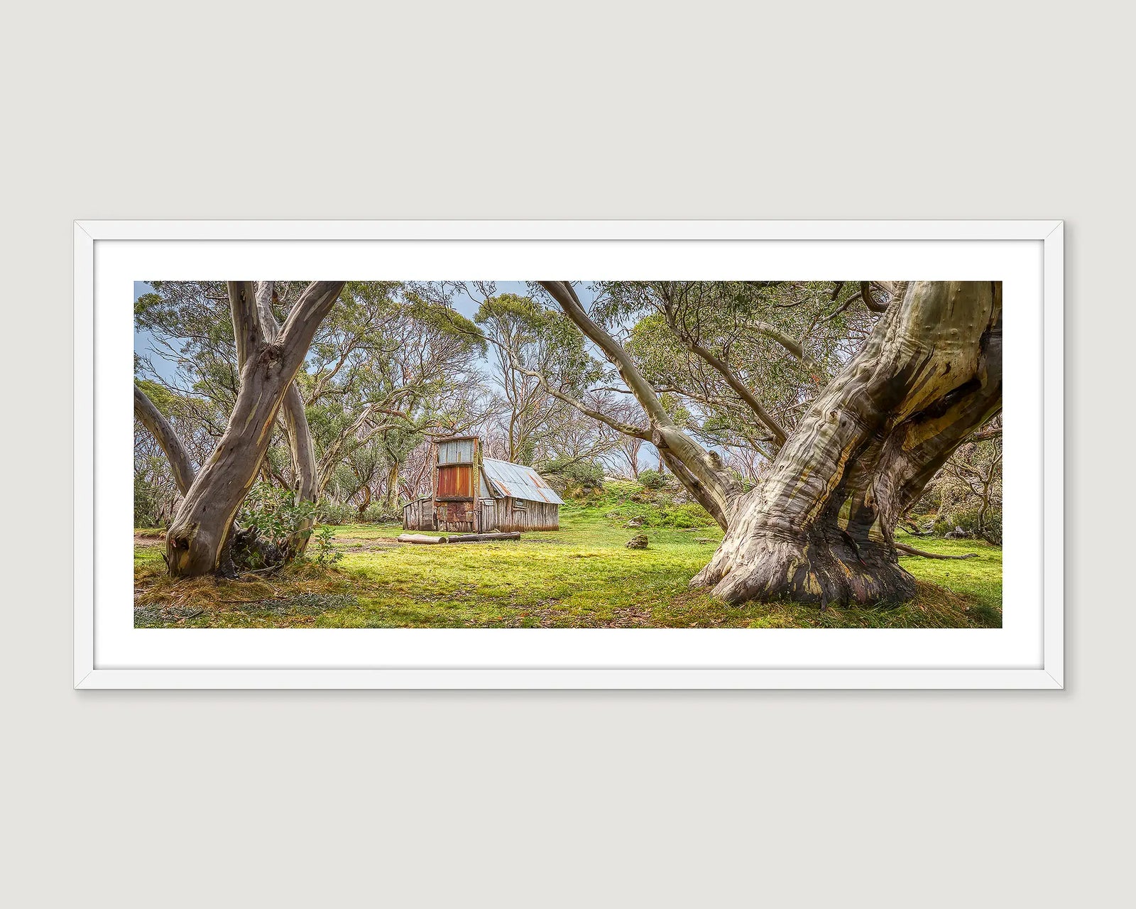 Framed photograph of Wallaces Hut nestled amongst the snow gums on the Bogong High Plains. 