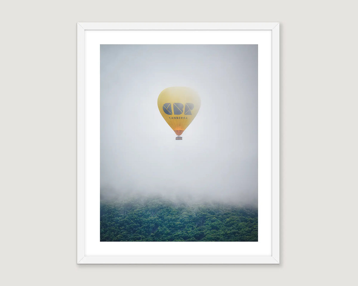 Framed wall art print of the yellow CBR balloon emerging from cloud over Black Mountain.