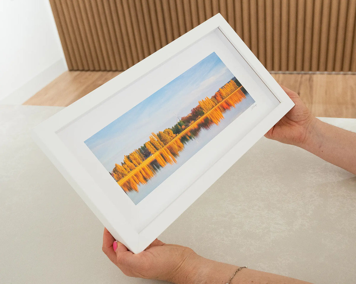 Changing Seasons. Autumn sunset over Lake Burly Griffin Canberra, with white frame being hand held.