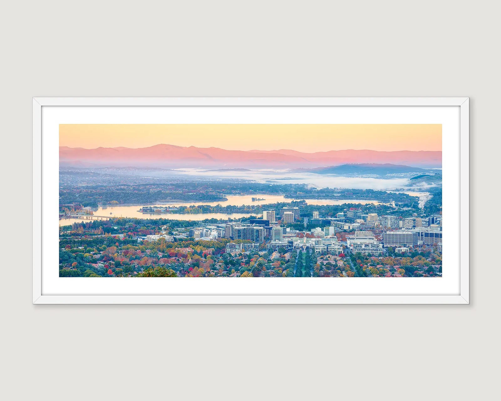 Framed photograph of aerial views of civic, out to the Brindabellas, on an autumn morning. 