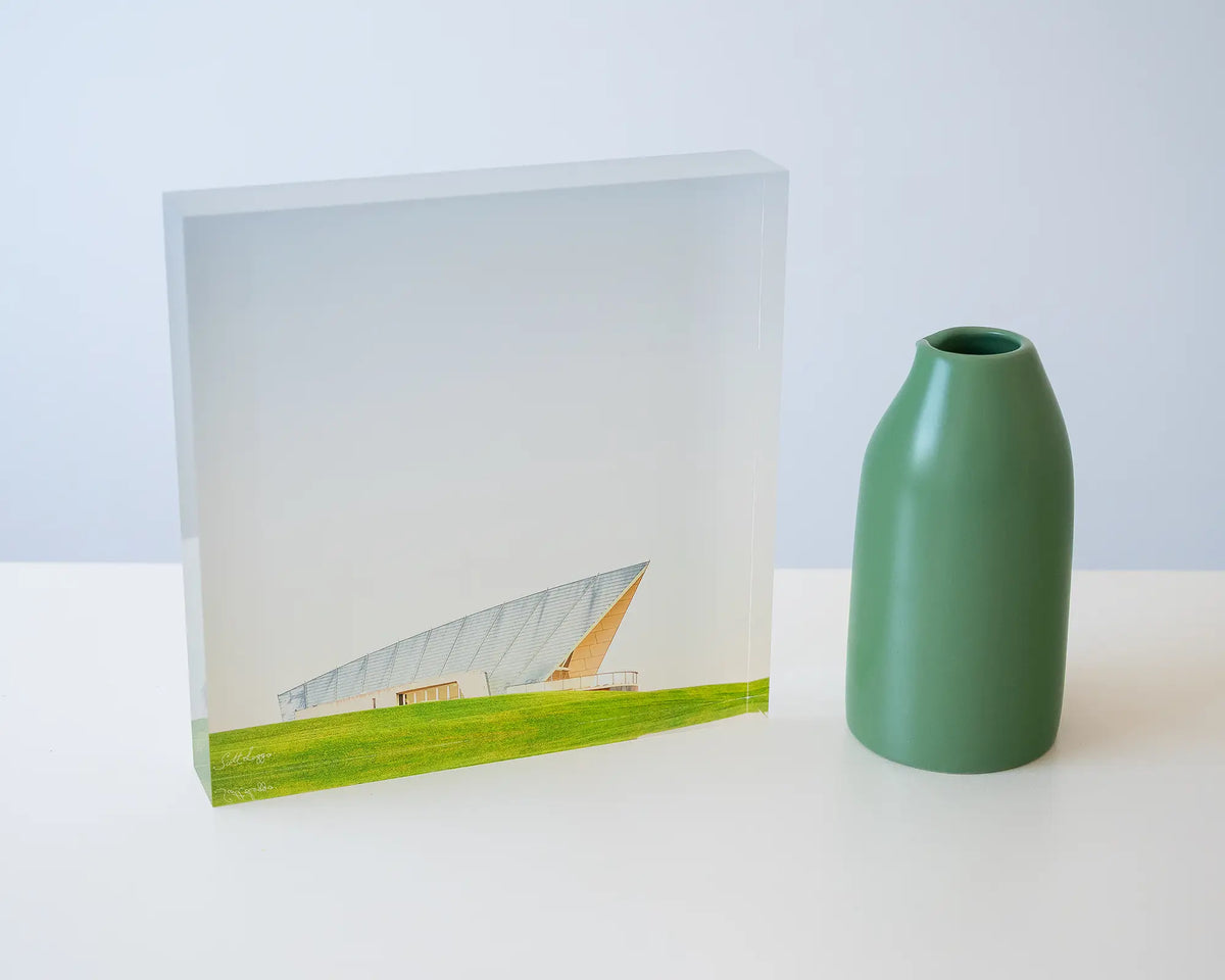 Clarity. Acrylic block Margaret Whitlam Pavilion, National Arboretum Canberra, styled with a small vase.
