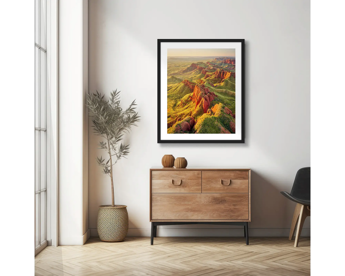 Classic Kimberley. Aerial photographic wall art print with a black frame, hung in a scandi hallway. 