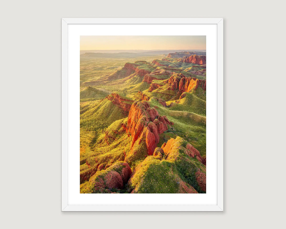 Framed aerial photograph of a sunset over Ragged Range, the Kimberley. 
