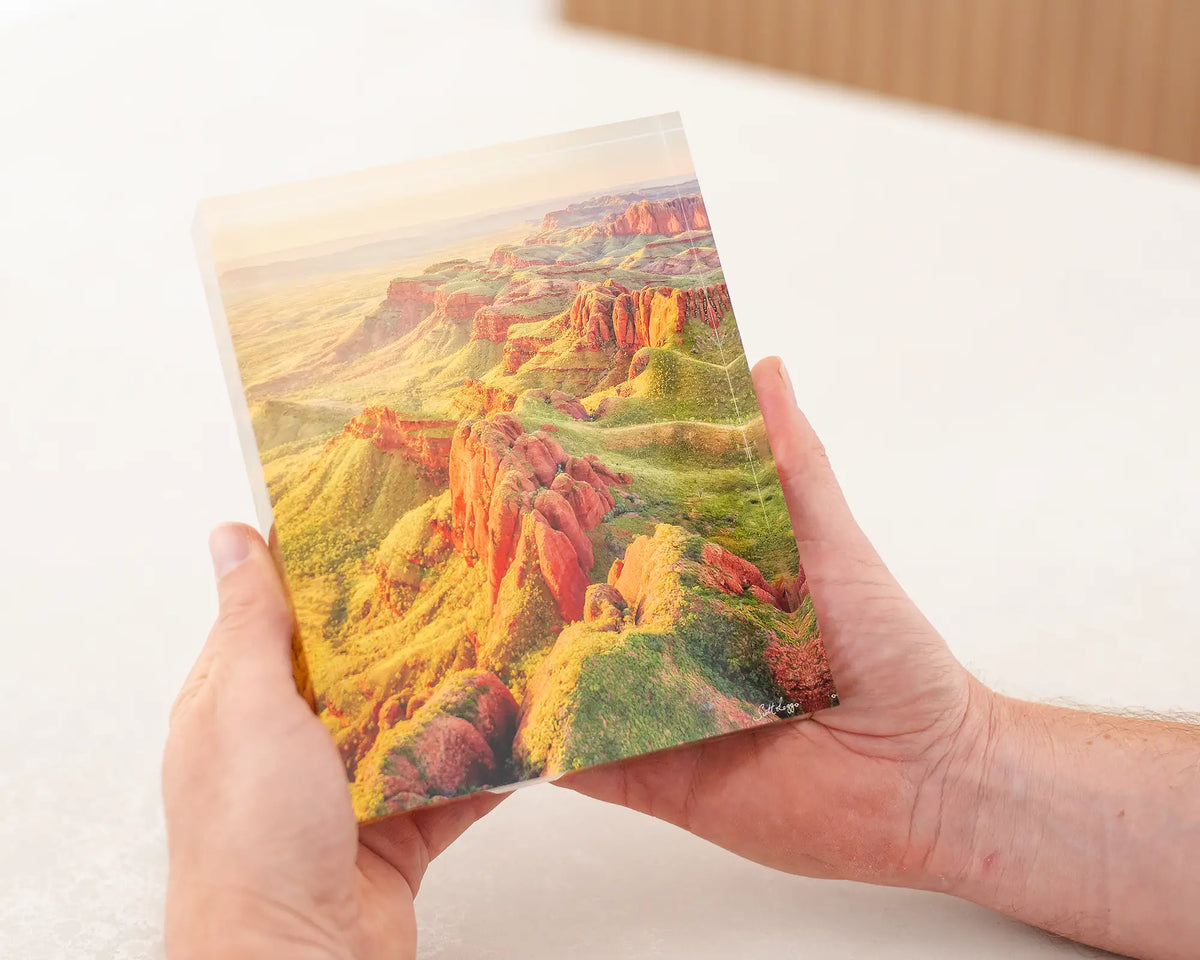 Classic Kimberley - Mountain range at sunset, acrylic block being held in hands.