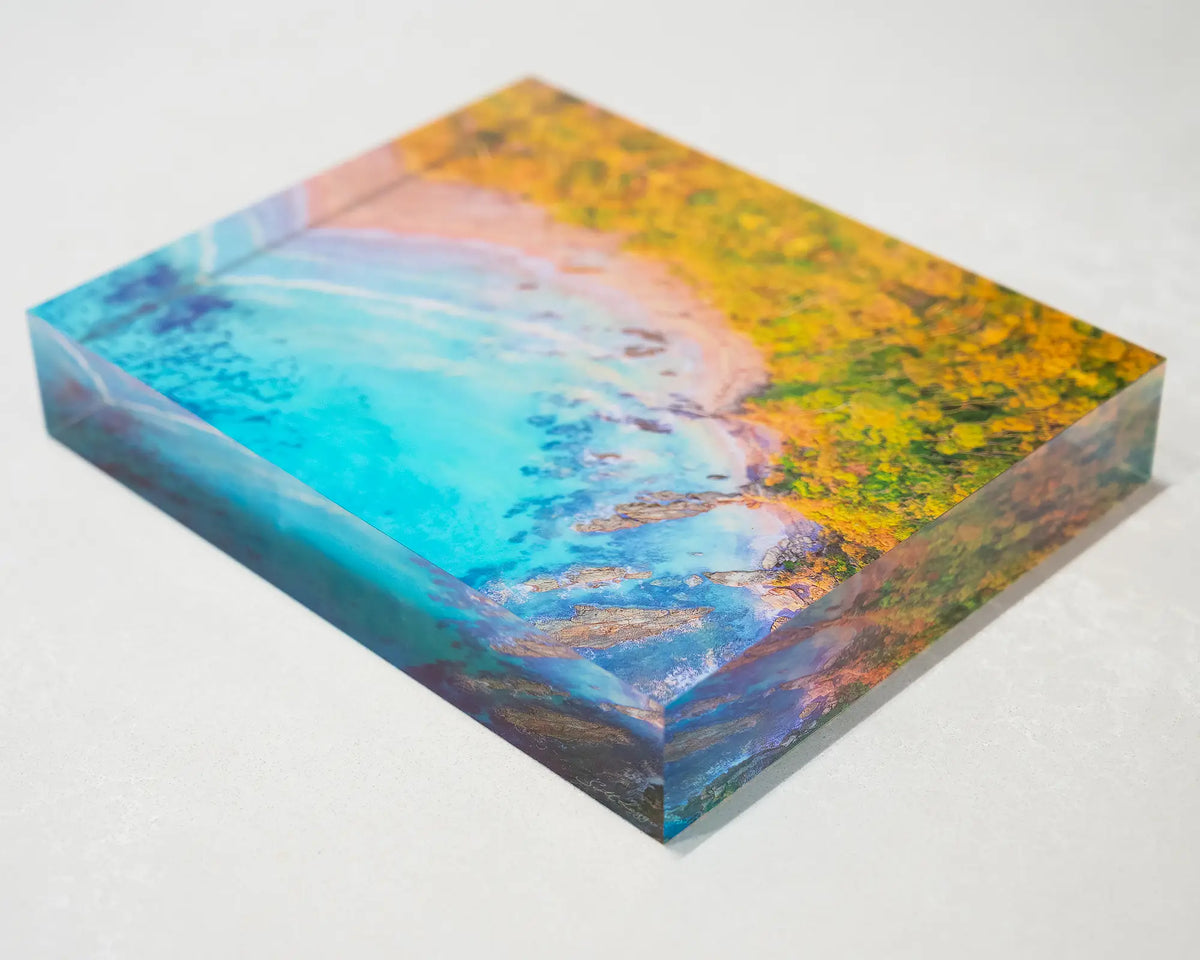 Coastal Bliss. Acrylic block of sunrise at Lilli Pilli Beach, New South Wales, laying flat on a table.