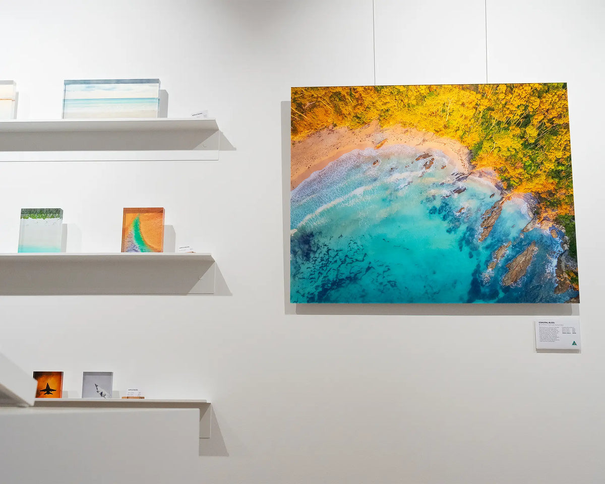 Coastal Bliss. Aerial coastal wall art frameless acrylic, on gallery wall with small acrylic blocks.