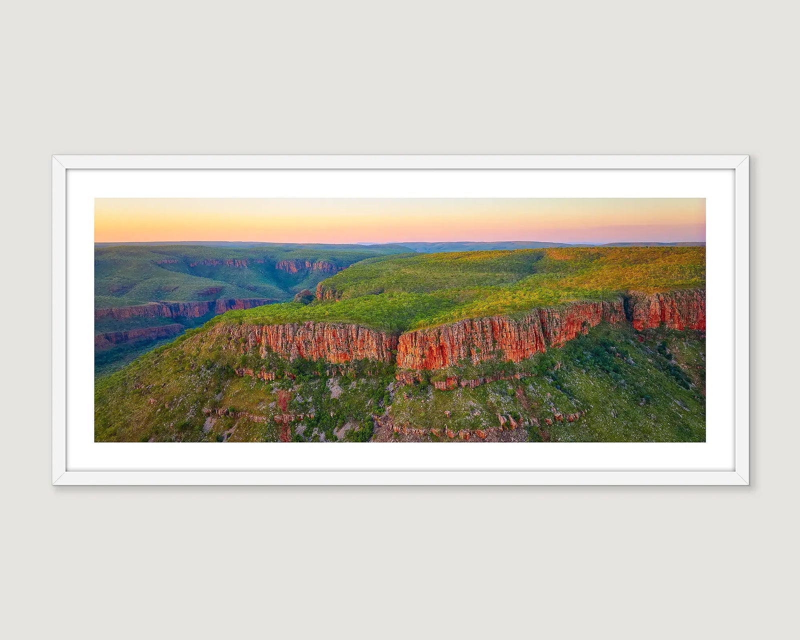 Framed photograph of a sunset over the Cockburn Ranges, El Questro, in the Kimberley region. 
