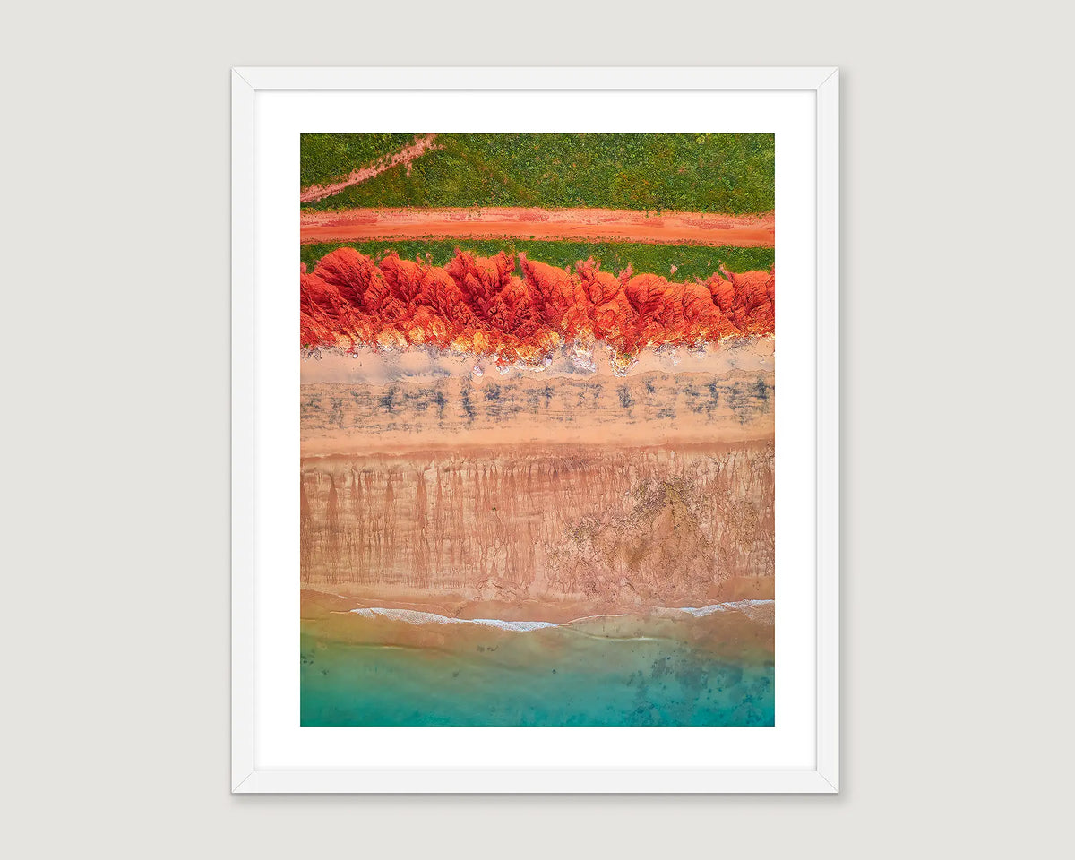 Framed abstract, aerial wall art, of the red earth meeting the turquoise ocean at James Price Point. 
