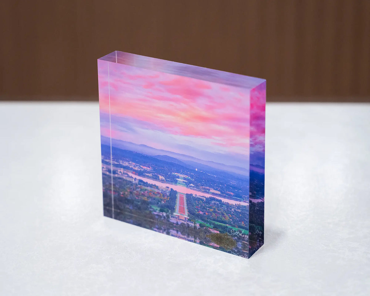 Colours Of Canberra. Acrylic block sunrise over Canberra, sitting on desk.