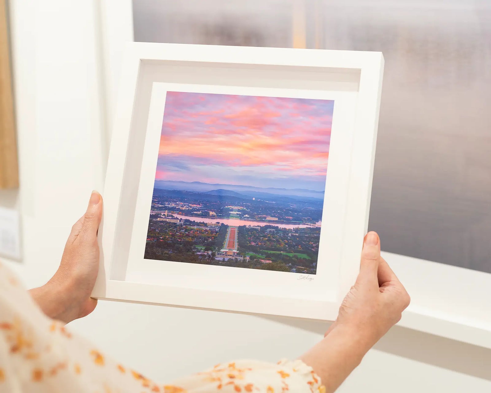 Framed photograph of an aerial view of Canberra from the War Memorial to Parliament House, taken from Mount Ainslie. 