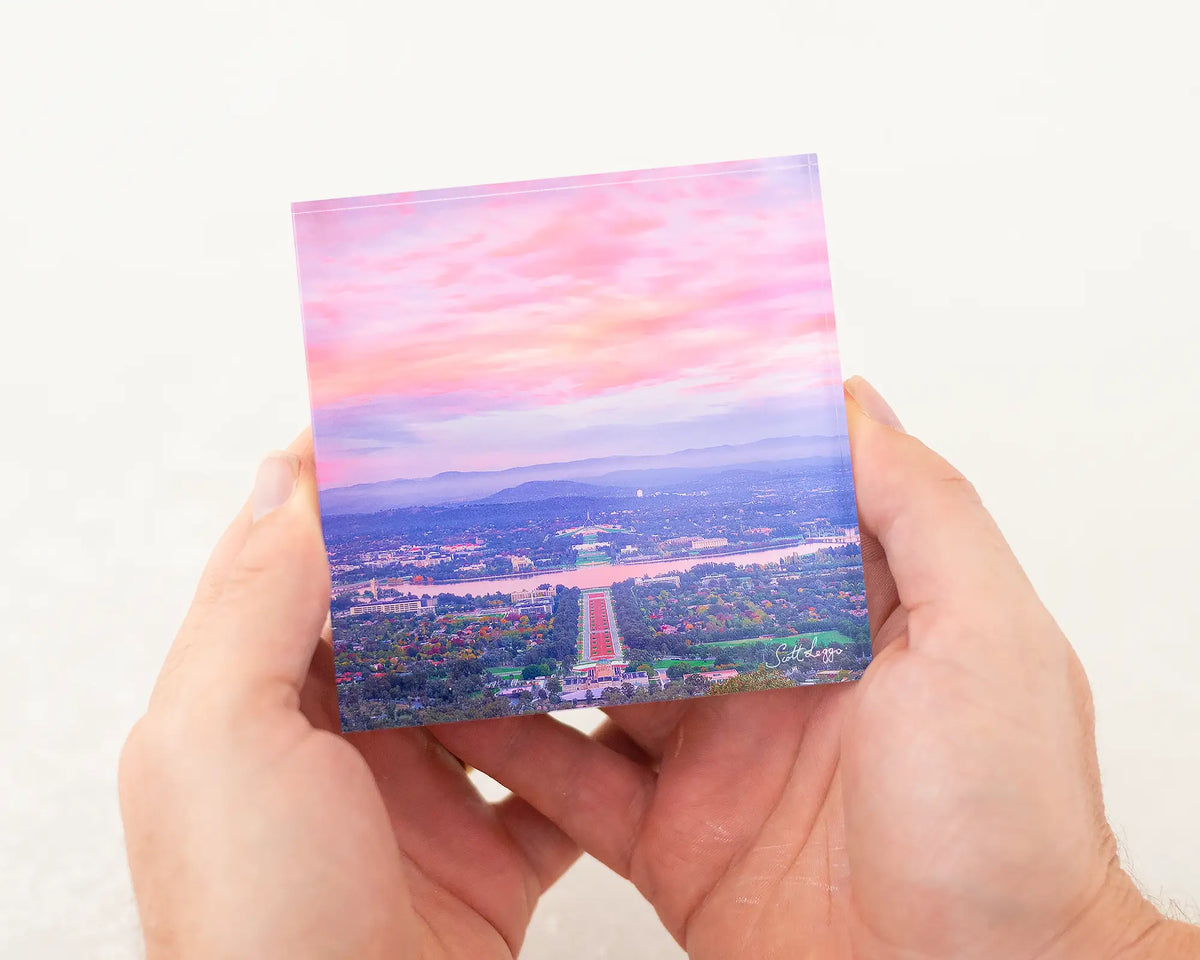 Colours Of Canberra - Colourful sunrise over Canberra acrylic block artwork being held in hand.