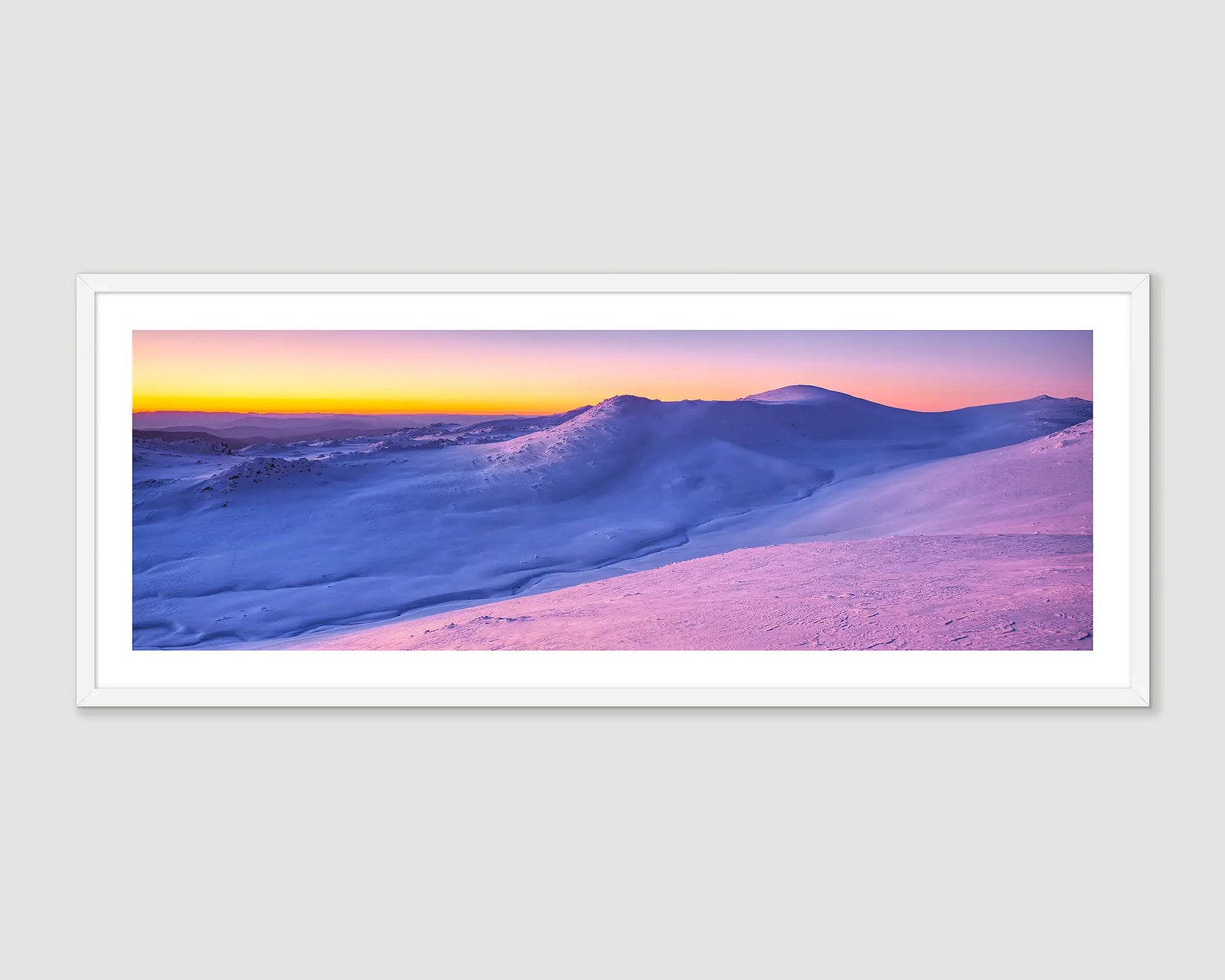 Framed artwork of a snowy sunset on Mount Kosciuszko. 