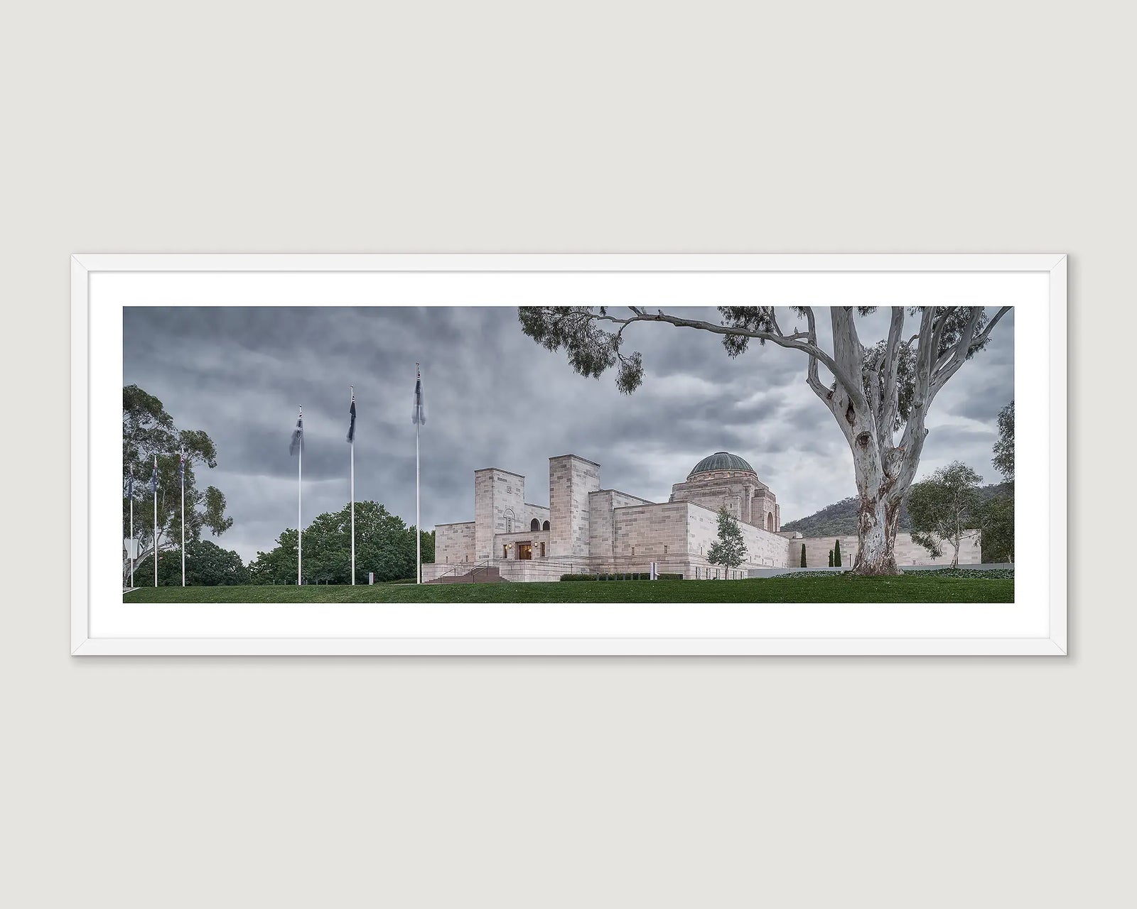 Framed photograph of the Australian War Memorial with a cloudy sky.