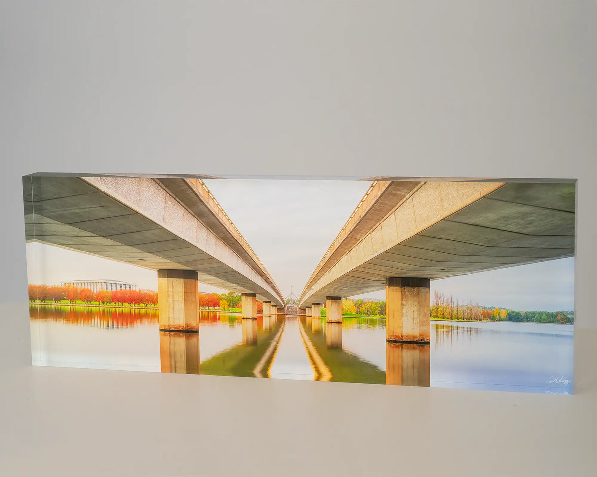 Convergent. Acrylic block of Commonwealth Avenue Bridge Canberra, in Autumn at sunrise.