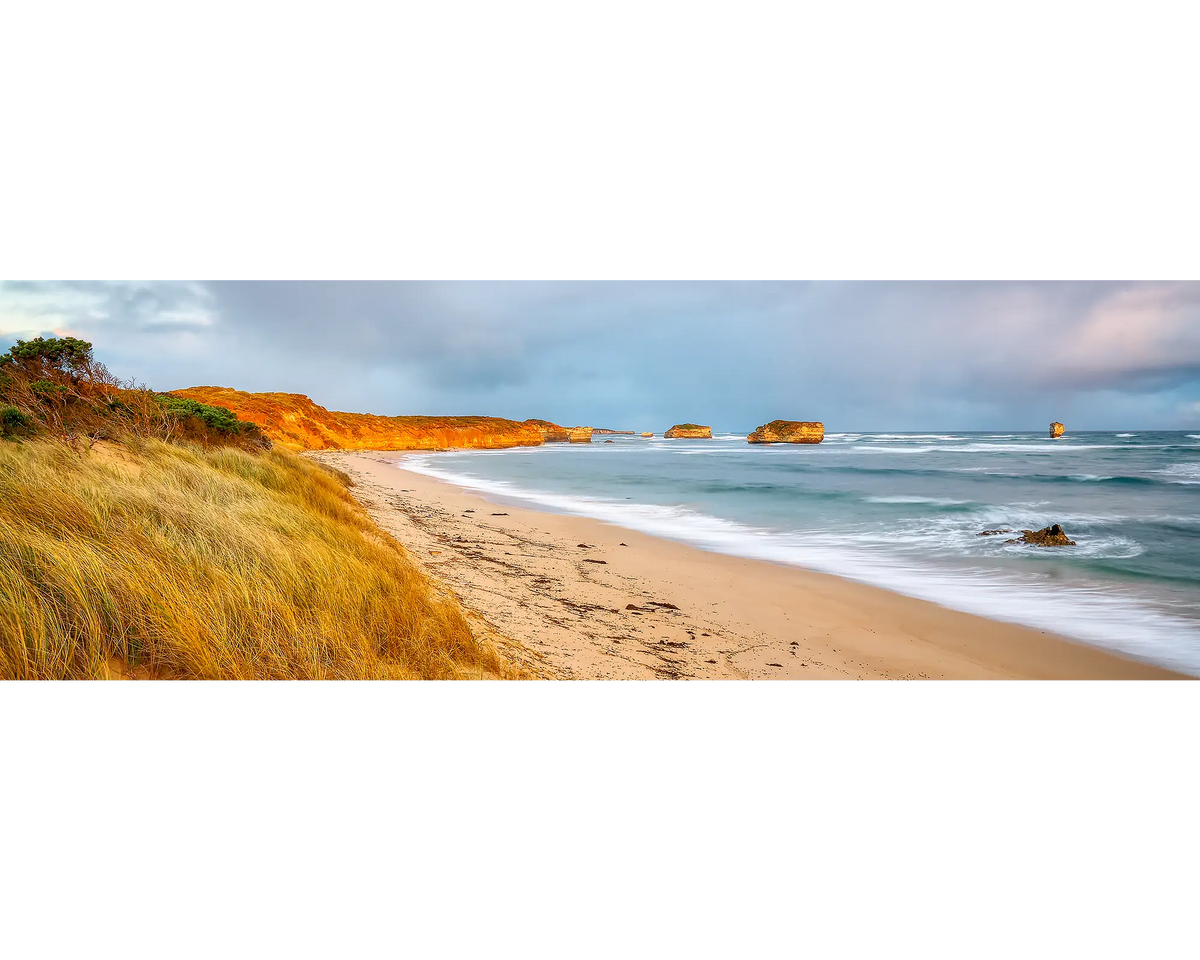 Crofts Bay, Victoria, at sunset with orange cliffs.