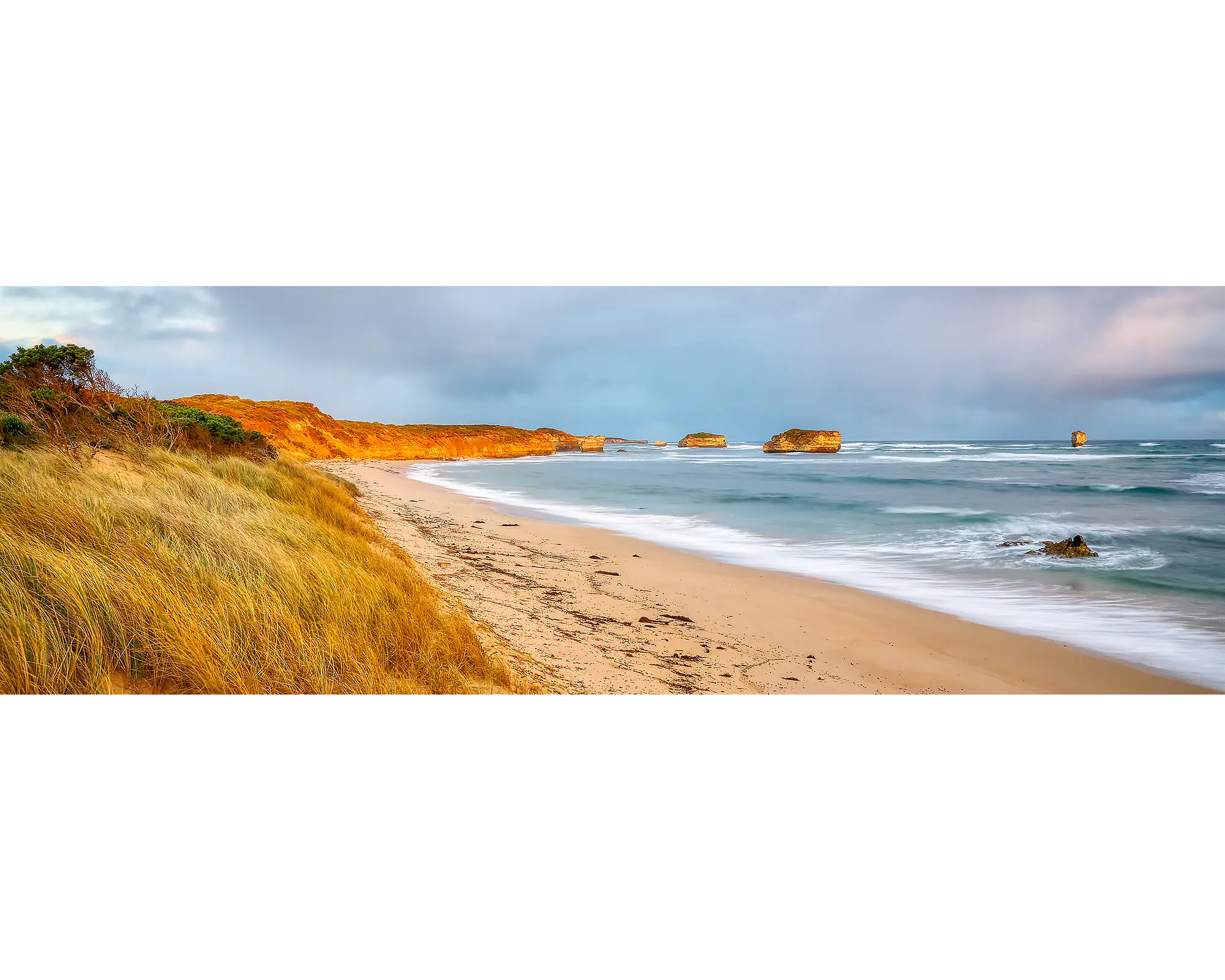 Crofts Bay, Victoria, at sunset with orange cliffs.