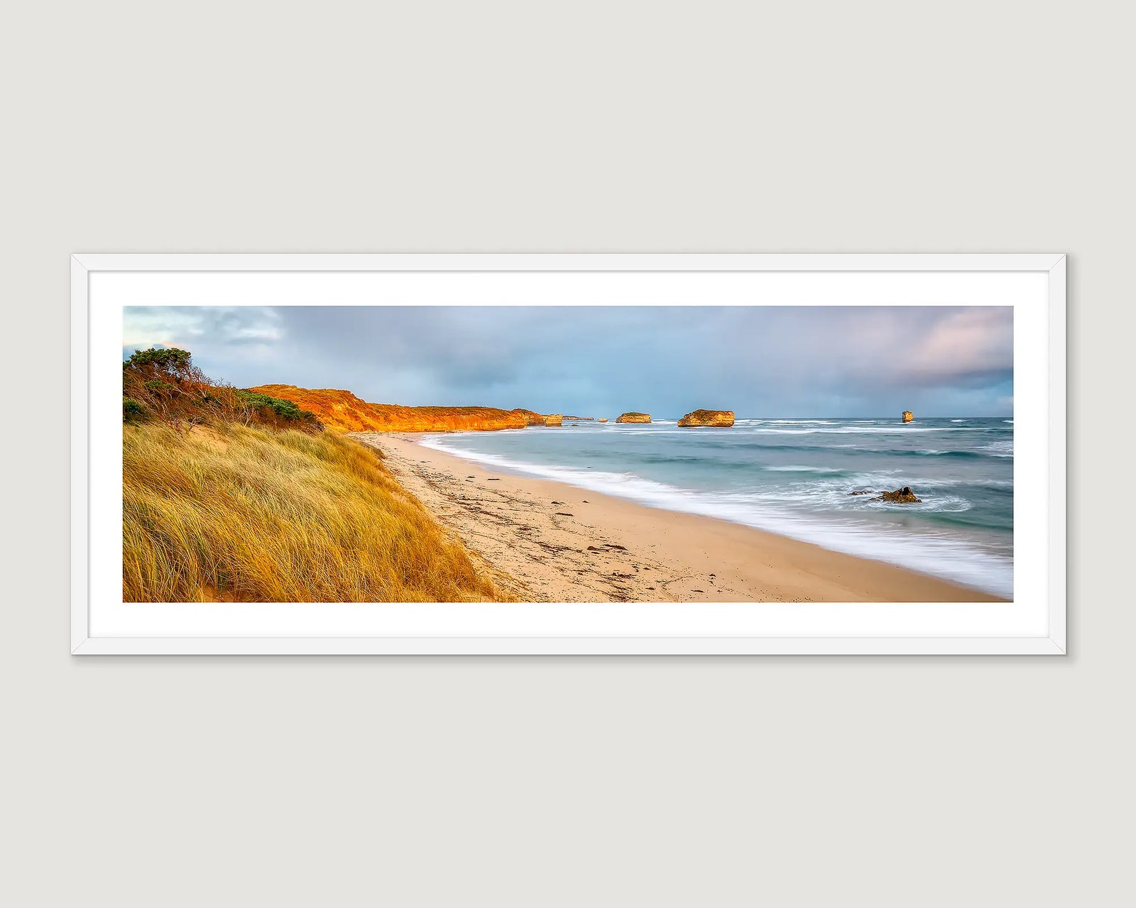 Framed photographic print of a coastal scene of storm clouds over Croft's Bay at sunset. 